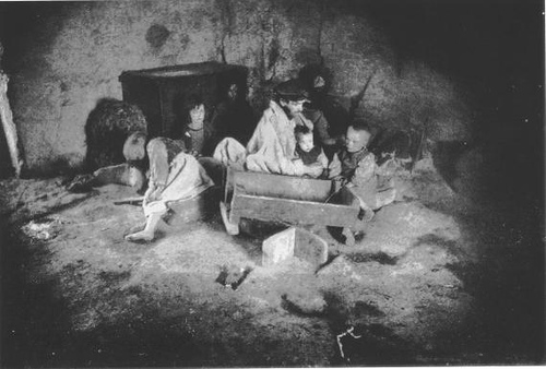 http://commons.wikimedia.org/wiki/Image:Starving_Irish_family_during_the_potato_famine.JPG
