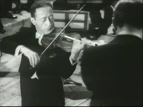 http://commons.wikimedia.org/wiki/File:Jascha_Heifetz_-_Carnegie_Hall_1947_%2805%29_wmplayer_2013-04-16.jpg