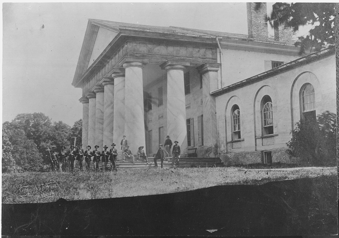 https://commons.wikimedia.org/wiki/File:East_front_of_Arlington_Mansion_(General_Lee%27s_home),_with_Union_soldiers_on_the_lawn,_06-28-1864_-_NARA_-_533118.jpg